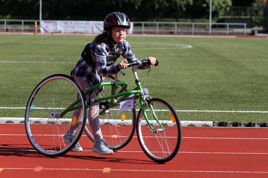 Photo of a girl using a RaceRunner on the track