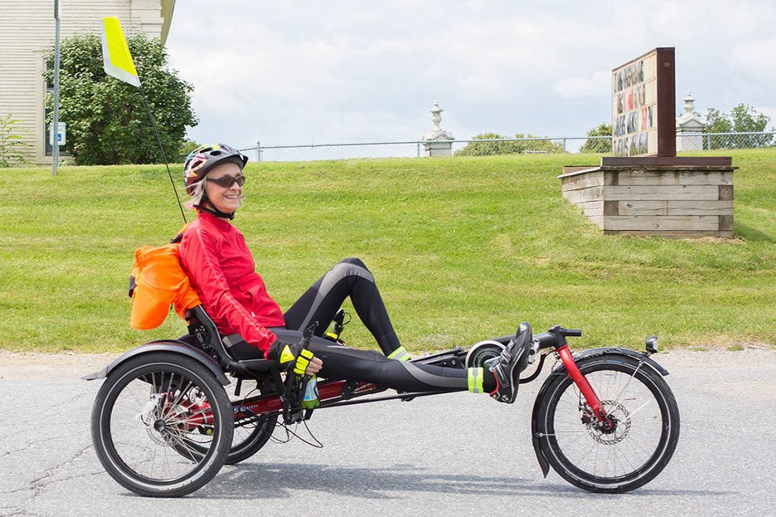 woman on a Hase Kettwiesel recumbent trike