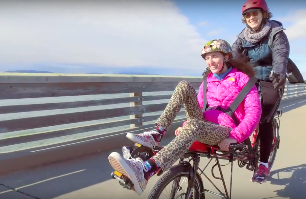 Camille and her mother riding a Hase Bikes Pino semi-recumbent tandem
