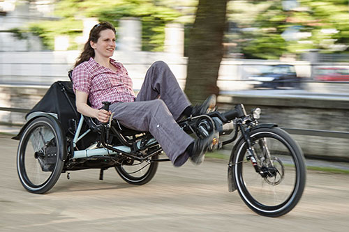 woman riding a Hase Evo Steps recumbent e-trike