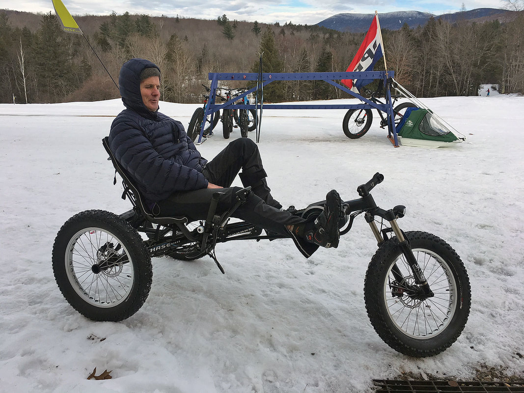 Larry Buck riding the Adaptive Trike Rikert's fat tire recumbent trike in the snow